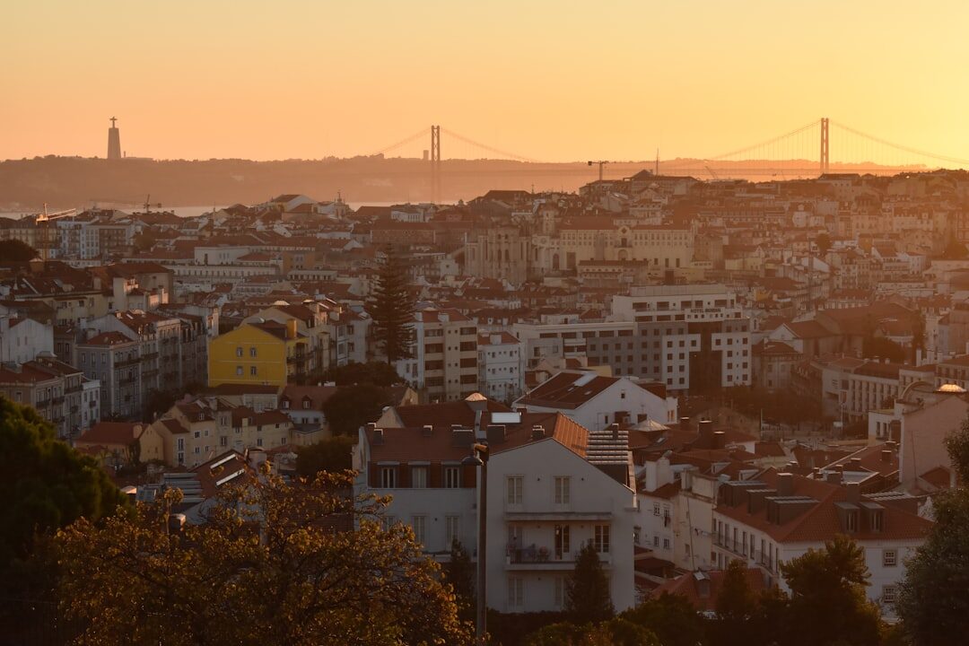 Historic Lisbon neighbourhood rooftops viewed from above at dusk
