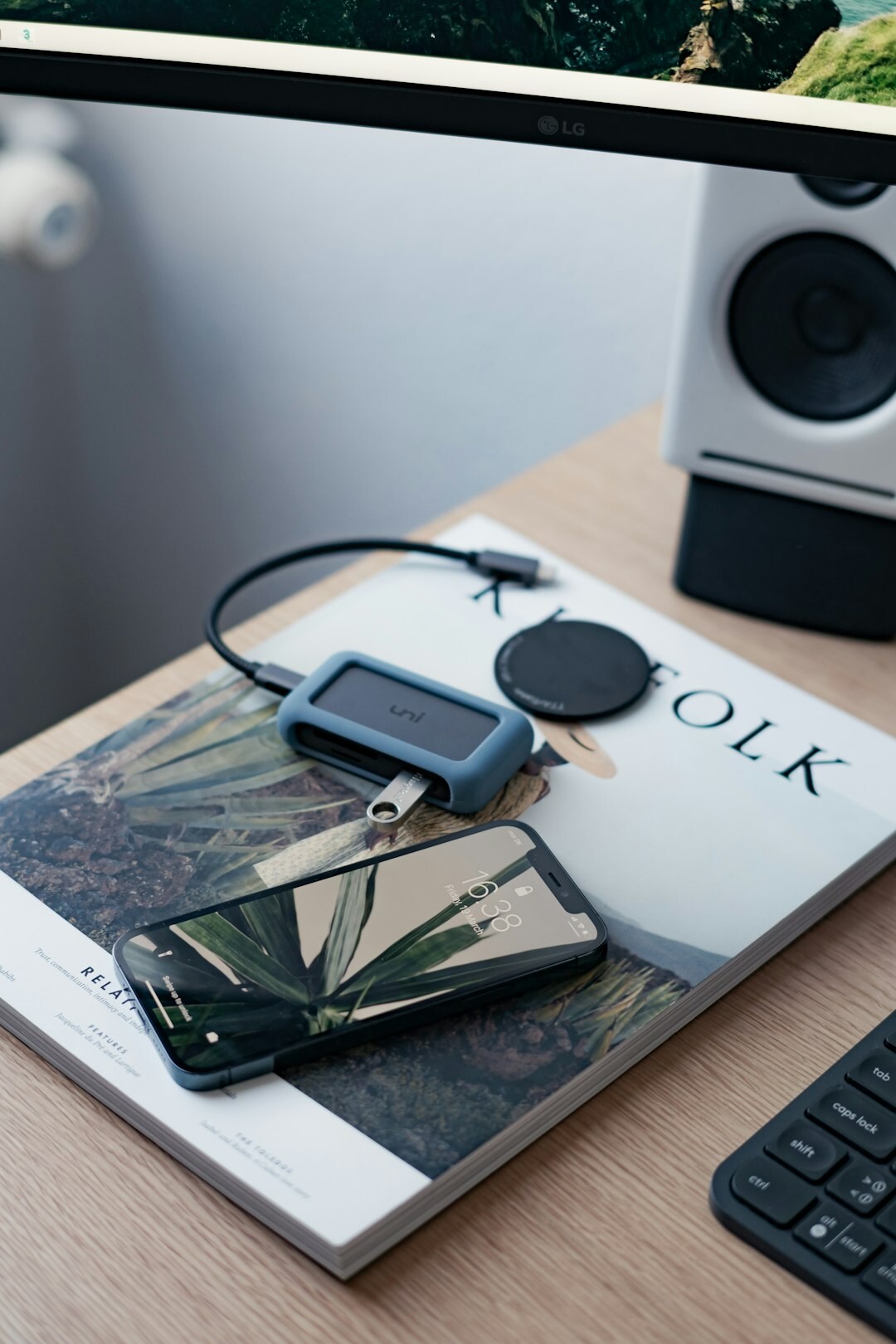 Encrypted phone and notebook on a desk representing secure communication with a news source