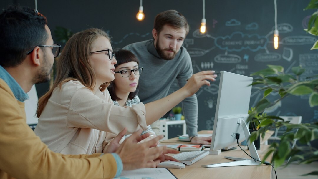 team analyzing data on screen