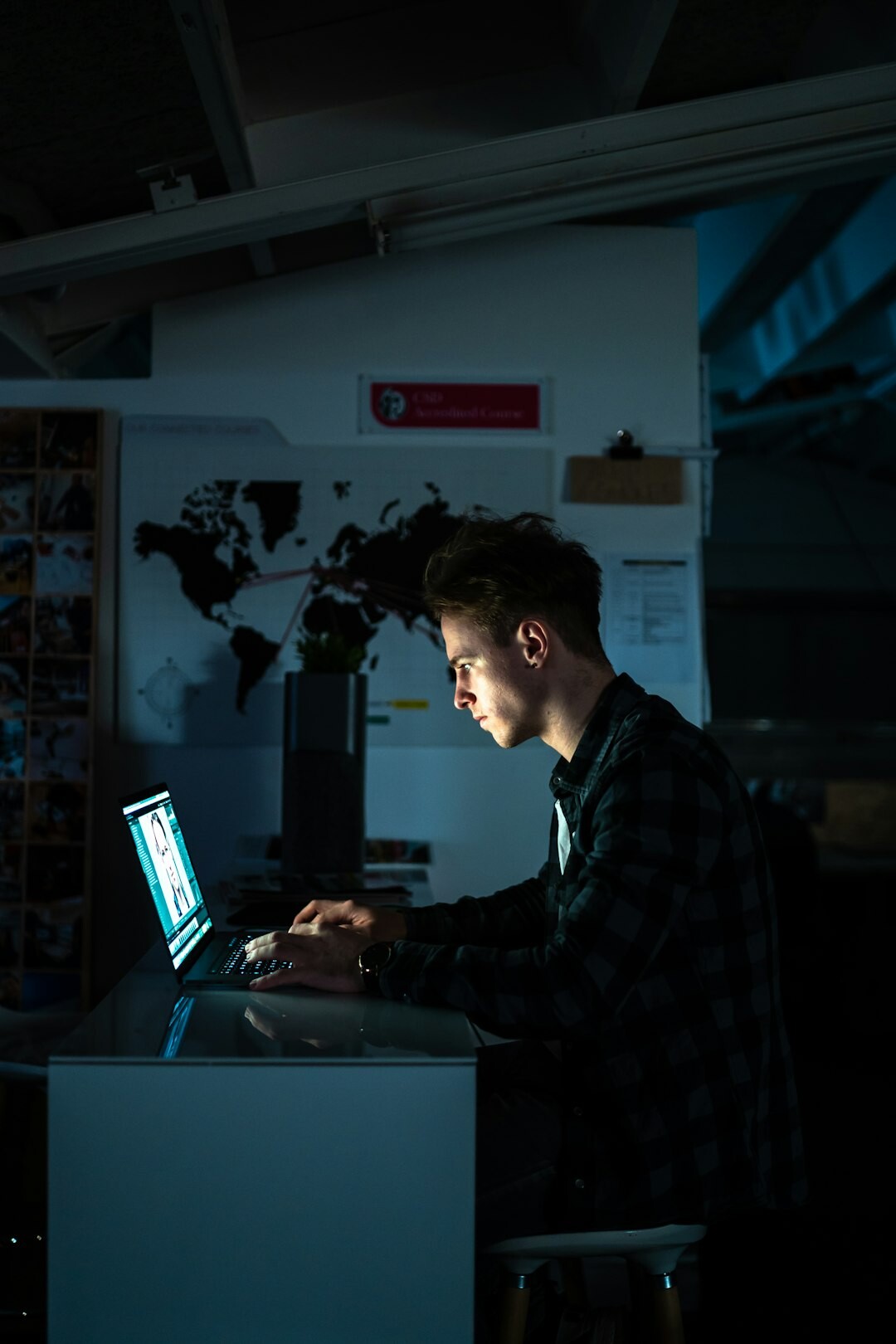 person using laptop at night
